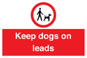 dogs-on-lead-symbol-with-black-text-on-white-background~